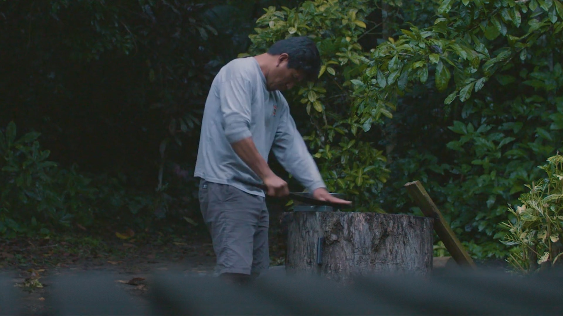 This image shows a man in the Amazon jungle sharpening his knife.jpg